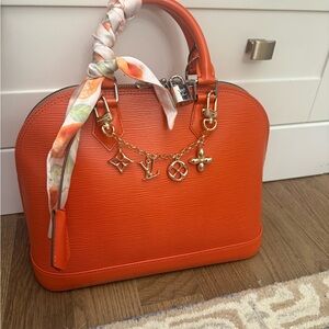 Louis Vuitton Orange sunset Alma Handbag in like new condition. Bag only!